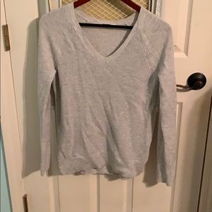 Grey metallic sweater.